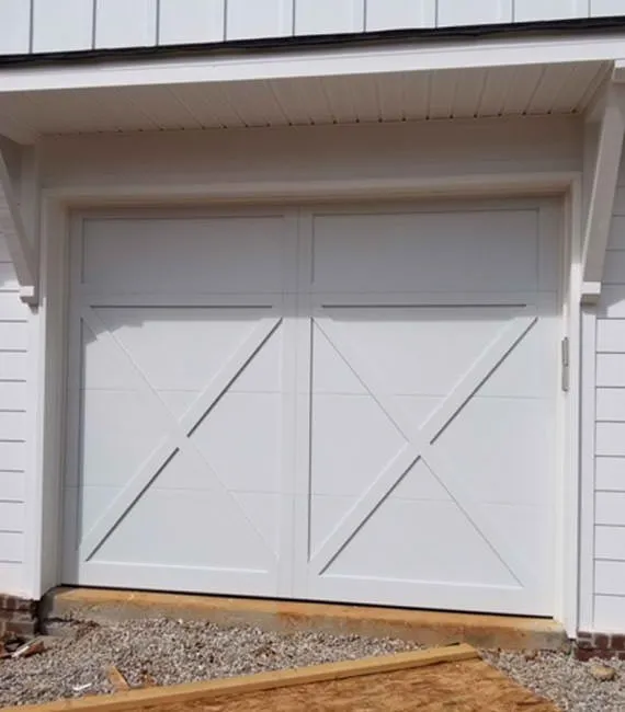 Carriage garage door with a white overlay 